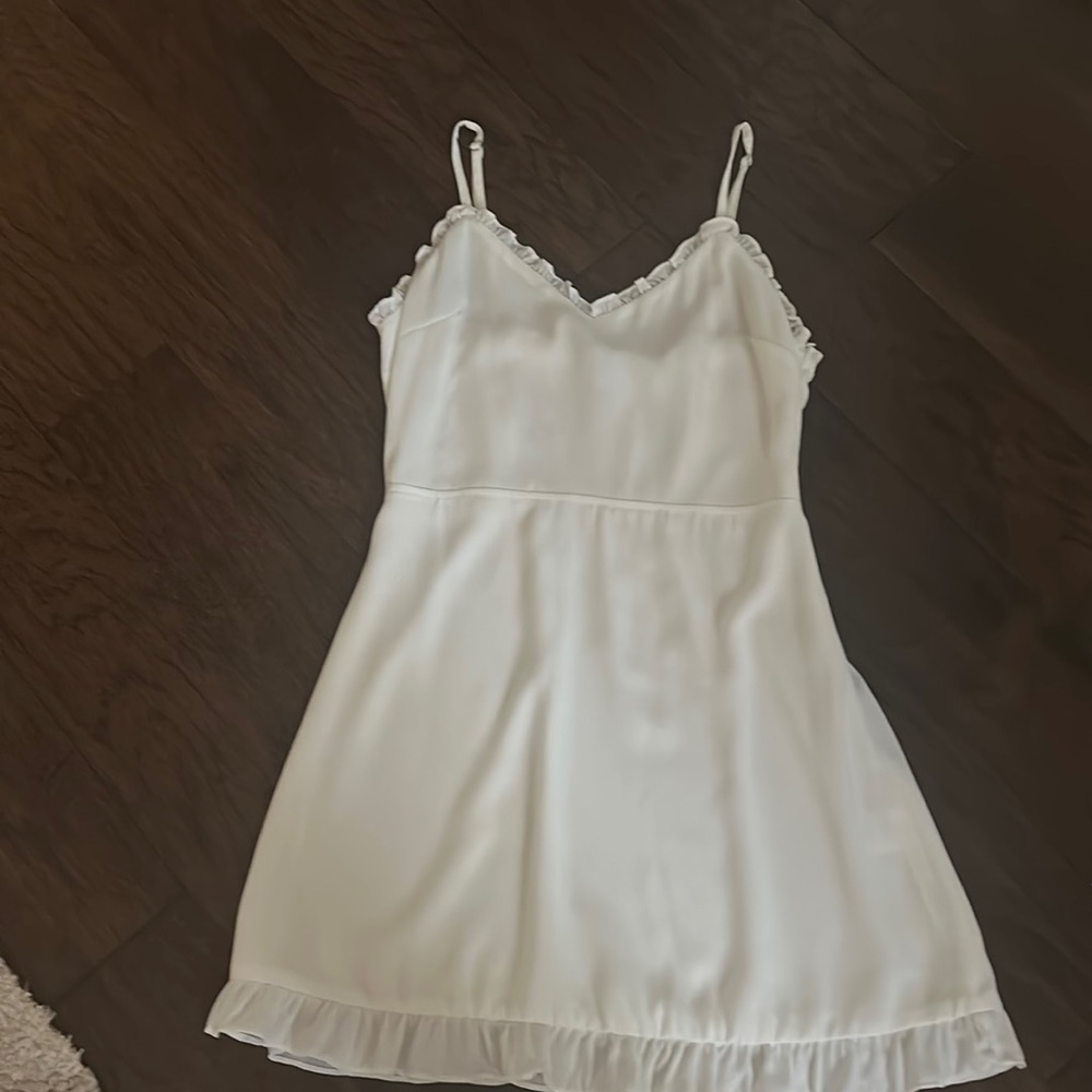 Beautiful white dress w delicate ruffle details  perfect condition. On trend